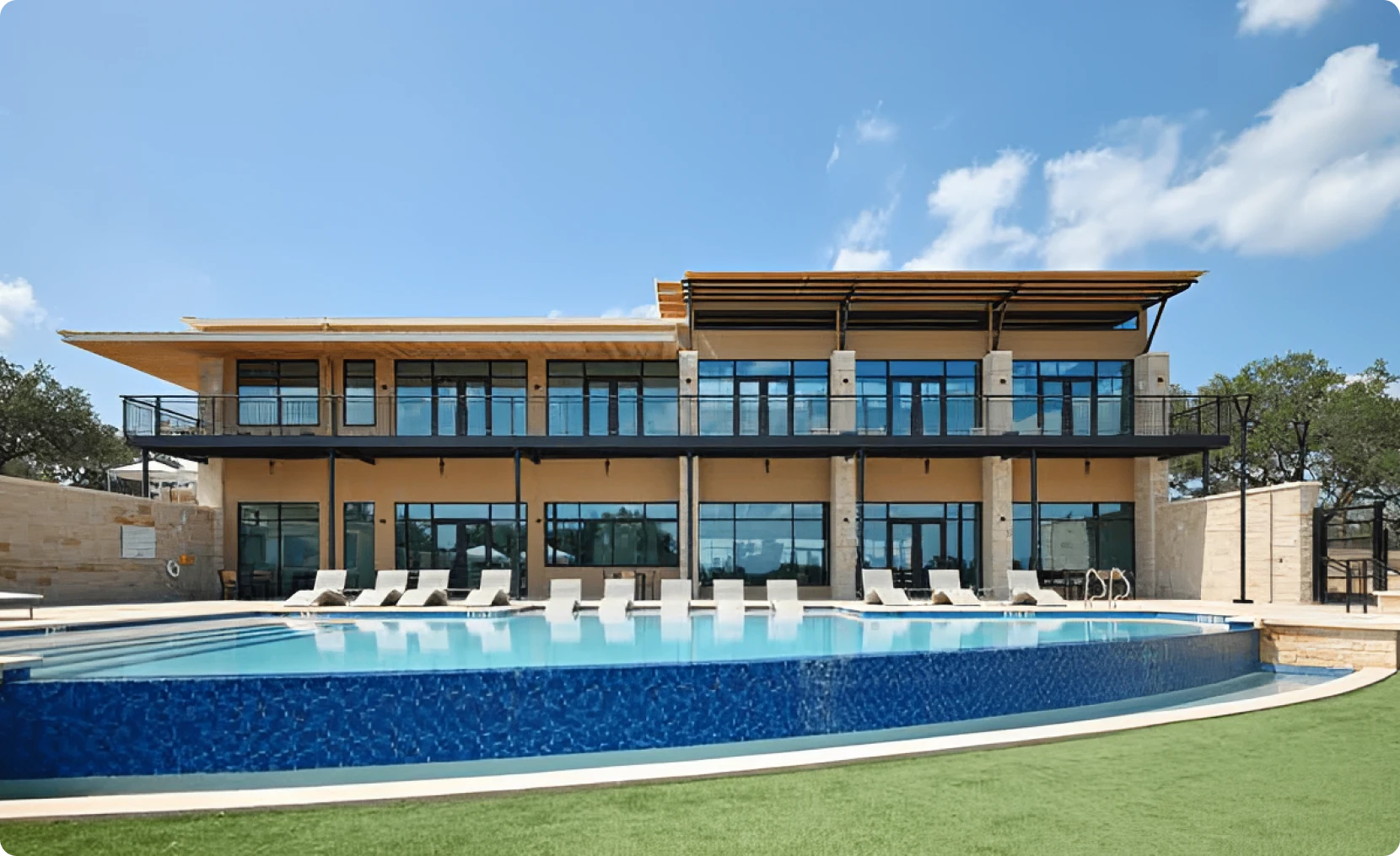 Contemporary home exterior with blue pool