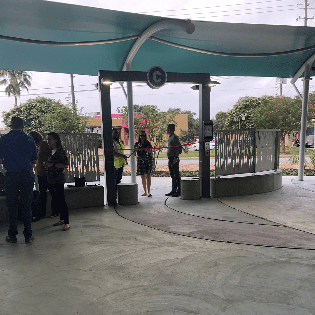 People standing under a covered walkway.